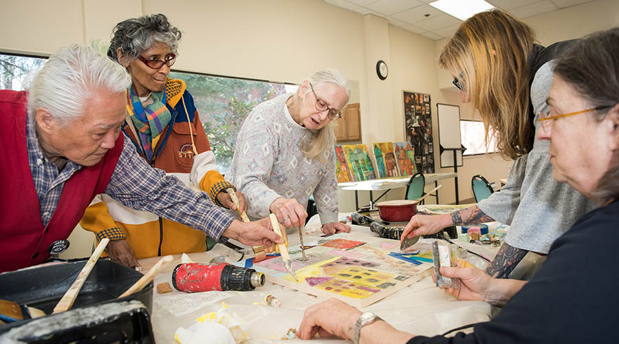Seniors enjoying an art activity